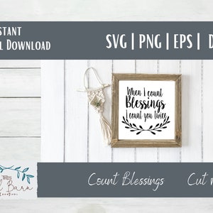 May include: A digital download of a cut file design featuring a white background with black text that reads "When I count Blessings I count you twice". The text is surrounded by a wreath of leaves. The design is framed in a brown frame and is sitting on a white wooden surface.