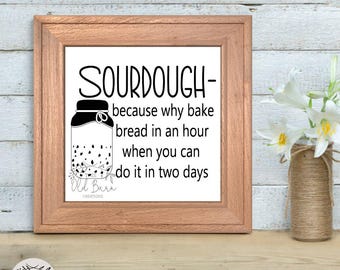 May include: A framed print with a black and white illustration of a jar of sourdough starter. The text reads "SOURDOUGH- because why bake bread in an hour when you can do it in two days".