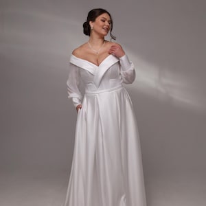 Minimalistyczna satynowa suknia ślubna w kształcie litery A z odkrytymi ramionami i kieszeniami, elegancka suknia ślubna |