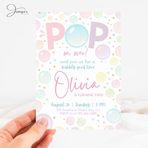 May include: A pastel-colored invitation with the text "POP on over!" and "Olivia is turning two!" The design features bubble illustrations in shades of pink, blue, and yellow. The invitation includes the date, time, and RSVP information.