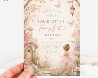 May include: A rectangular invitation card featuring a watercolour illustration of a fairy in a pink dress, a mushroom house, butterflies, and flowers. The text reads: Please join us for Charlotte's fairy first birthday, Monday, Nov 17 at 4 pm.