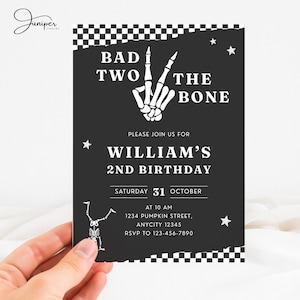 May include: Black and white birthday invitation with the text "BAD TWO THE BONE" and a skeleton hand making a peace sign. The invitation includes the name "WILLIAM'S" and the date "SATURDAY 31 OCTOBER".