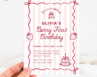May include: A pink and white invitation with the text "OLIVIA'S Berry First Birthday." The invitation includes illustrations of strawberries and a cake. The text also includes the date, time, and location of the party.