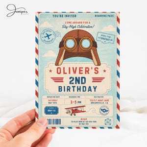 May include: A vintage-style boarding pass invitation for Oliver's 2nd birthday featuring a brown aviator cap, a red biplane, and blue sky background. The text includes 'You're Invited', 'Sky-High Celebration', and flight-themed details.