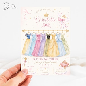May include: A birthday invitation card featuring a watercolor illustration of eight colorful princess gowns hanging on a gold rod. The text reads: Our Little Princess Charlotte Is Turning Three, Join us for a Royal Celebration, October 18.