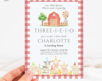 May include: A party invitation with a red and white gingham border. The invitation features a watercolor illustration of a barn, windmill, and farm animals. Text includes "THREE-I-E-I-O" and "Charlotte is turning three."