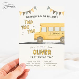 May include: A birthday invitation featuring a yellow school bus illustration. The text reads "The Toddler on the Bus Turns Two" with the name "Oliver" and party details. The design includes decorative banners and musical notes.