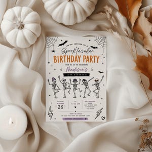 The image is a Halloween-themed birthday party invitation featuring a group of dancing skeletons, a spider web, and autumn leaves.