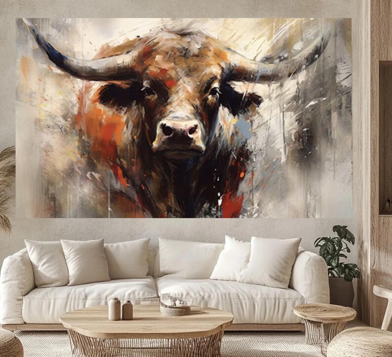 May include: An abstract painting of a bull's head, featuring a brown and orange color palette with black accents. The artwork has a textured, brushstroke style, with the bull's horns prominently displayed. The background is a mix of neutral tones.