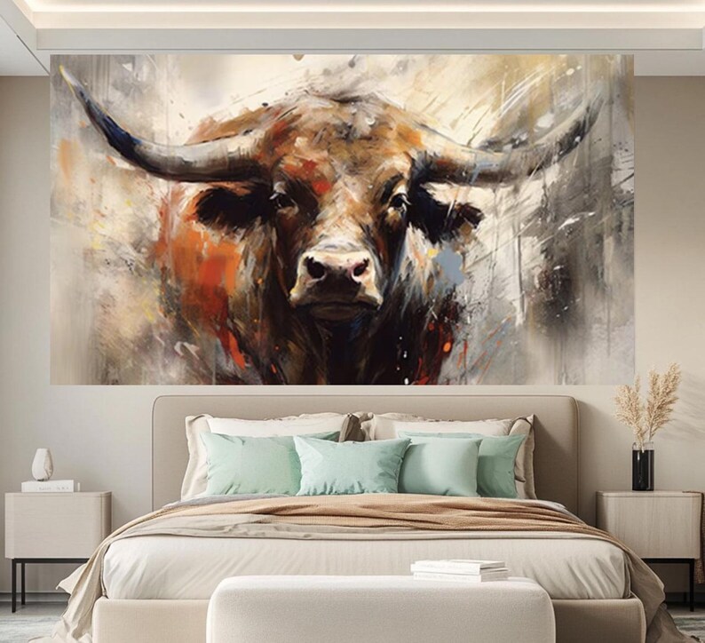 May include: Large wall art featuring a close-up of a bull's head. The artwork uses a palette of browns, oranges, and grays, with visible brushstrokes creating a textured effect. The bull's horns are prominent, and the overall style is abstract and expressive.