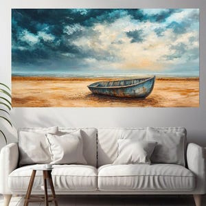 May include: A weathered blue wooden boat sits on a sandy beach with a cloudy sky and ocean in the background.