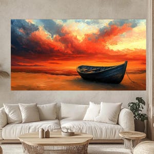 May include: A painting of a dark wooden boat on a beach with a bright orange and red sunset in the background.
