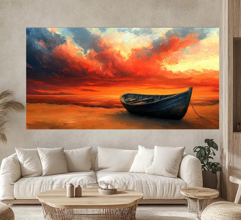 May include: A painting of a dark wooden boat on a beach with a bright orange and red sunset in the background.