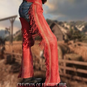 May include: Red leather chaps with fringe and studded detailing. The chaps are worn over blue jeans.