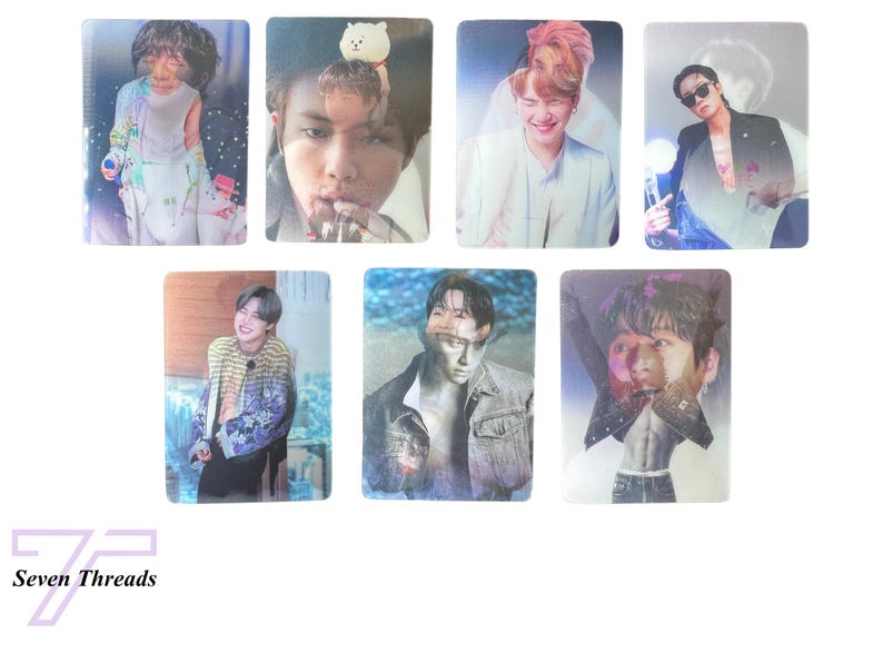 May include: Seven photo cards featuring different images of a young man. The cards are printed on a glossy, iridescent material that shimmers in the light. Each card features a different image of the man, with some images showing him smiling and others showing him with a more serious expression. The cards are all rectangular in shape and are approximately 3.5 inches by 2.5 inches in size.