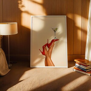 Framed art leaning against a wooden wall in cozy sunlight. Paired with a side table and neutral-toned decor, the print brings a playful energy to the scene.