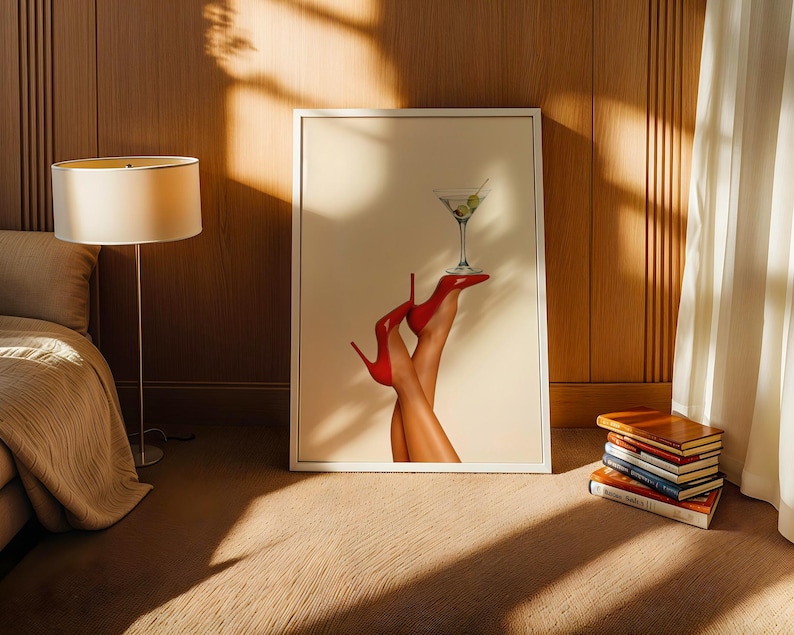 Framed art leaning against a wooden wall in cozy sunlight. Paired with a side table and neutral-toned decor, the print brings a playful energy to the scene.