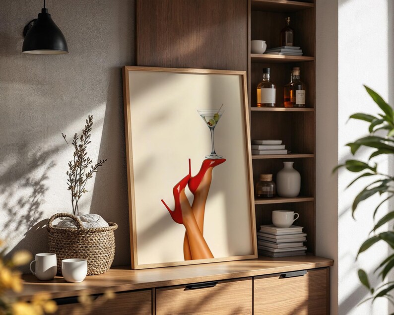 Art print placed on a wooden shelf with dried florals, neutral pottery, and a cozy backdrop. The red shoes create a striking focal point in a boho space.
