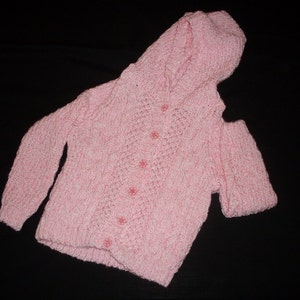 Hand knit pink and white girl&#39;s cable hooded cardigan