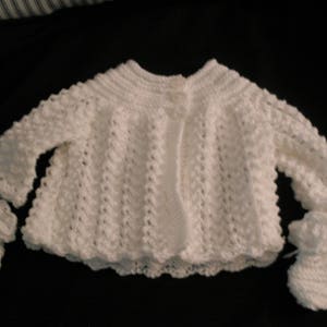 Hand knit baby girl&#39;s white lacy sweater set with bonnet, mittens, and booties