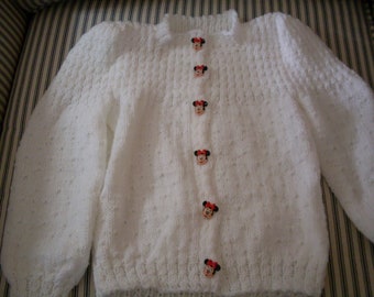 Hand knit little girl's white cardigan
