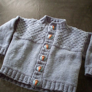 Hand knit boys denim blue cardigan with Toy Story/Woody buttons