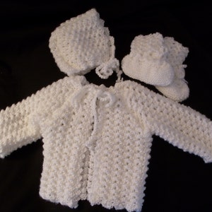 Hand knit girl&#39;s white sweater, hat, and booties