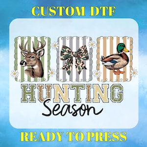 May include: A graphic design featuring a deer, a camouflage bow, and a duck, set against striped backgrounds with daisy accents. The text "HUNTING Season" and "READY TO PRESS" are also included.