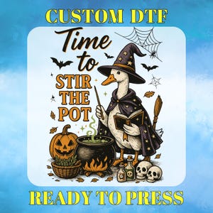 May include: A Halloween-themed graphic featuring a goose dressed as a witch, holding a wand and a book, with the text "Time to Stir the Pot." The image includes a cauldron, pumpkins, skulls, and the words "Custom DTF Ready to Press."