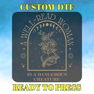 May include: A dark blue square design with gold text and illustrations. The text reads "A Well-Read Woman is a Dangerous Creature". The illustration is of a book with flowers and stars.