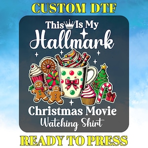 May include: A DTF transfer design with the text "This Is My Hallmark" above a graphic of a mug of hot chocolate, gingerbread men, cupcakes, and Christmas decorations. The text "Christmas Movie Watching Shirt" is below the graphic, and "READY TO PRESS" is at the bottom.