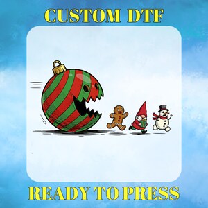 May include: A whimsical Christmas-themed graphic featuring a red and green striped ornament with a bite taken out of it, chasing a gingerbread man, a gnome, and a snowman. The text "CUSTOM DTF" and "READY TO PRESS" are displayed.
