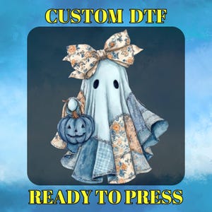 May include: A light blue ghost character with a floral bow and patchwork design, holding a blue pumpkin. The image has the text "CUSTOM DTF" and "READY TO PRESS" in yellow.
