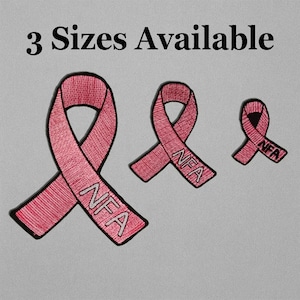 May include: Three pink ribbon patches with the text "NFA" embroidered on them. The ribbons are in three different sizes, with a black border and a gray background. The text "3 Sizes Available" is at the top.