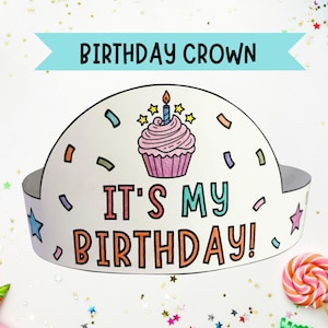 May include: A white birthday crown with the text "BIRTHDAY CROWN" and "IT'S MY BIRTHDAY!" The crown features a cupcake with a lit candle and colorful confetti. The crown is surrounded by party decorations.