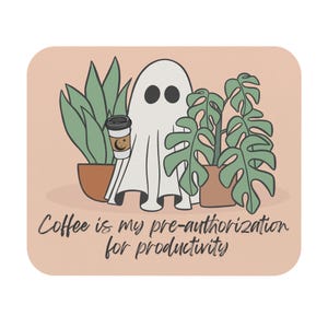 May include: A white ceramic mug with a black handle and the text "But First, Coffee" in a bold, black font. The mug is set against a blurred background, suggesting a cozy setting. The mug appears to be approximately 4 inches tall.