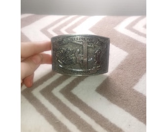 Wyoming Studio Art Works Telephone Industry Belt Buckle Pewter Rectangular 70s