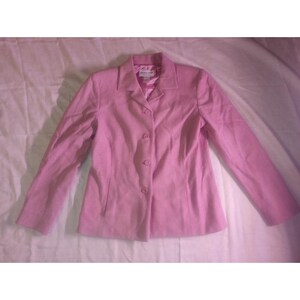 May include: A light pink blazer with a classic button-up design. The blazer features a notched collar, long sleeves, and a tailored fit. The jacket has three buttons down the front and two pockets.