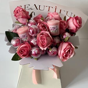 Pink Silk flowers(roses), Lindt chocolate and Candle Bouquet Hamper