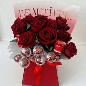 Dozen Red Silk roses, Lindt chocolate and Candle Bouquet Hamper