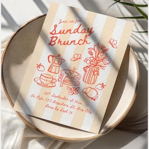 May include: A rectangular invitation card with vertical beige and white stripes featuring red line art illustrations of a moka pot, pancakes, a vase of flowers, and a croissant. The text reads: Join us for Sunday Brunch, 25th September at 10am, Le Cafe, 123 Anywhere St, Any City, RSVP by Sept 15.