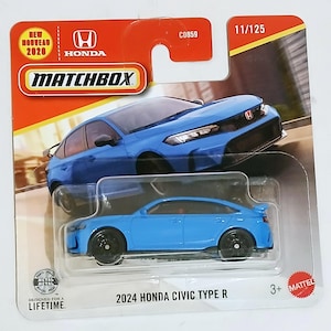 May include: A light blue Matchbox model of a 2024 Honda Civic Type R. The packaging features the Honda and Matchbox logos, and the text "Designed for a Lifetime". The model is a 1:64 scale, approximately 7 cm long.