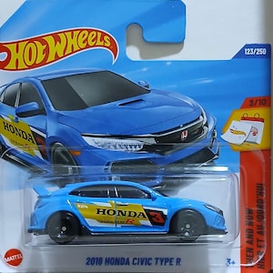 May include: A blue 2018 Honda Civic Type R Hot Wheels die-cast car. The car has black wheels and yellow and white accents with the Honda logo. The packaging includes the Hot Wheels logo and the text "WHEN AND NOW".