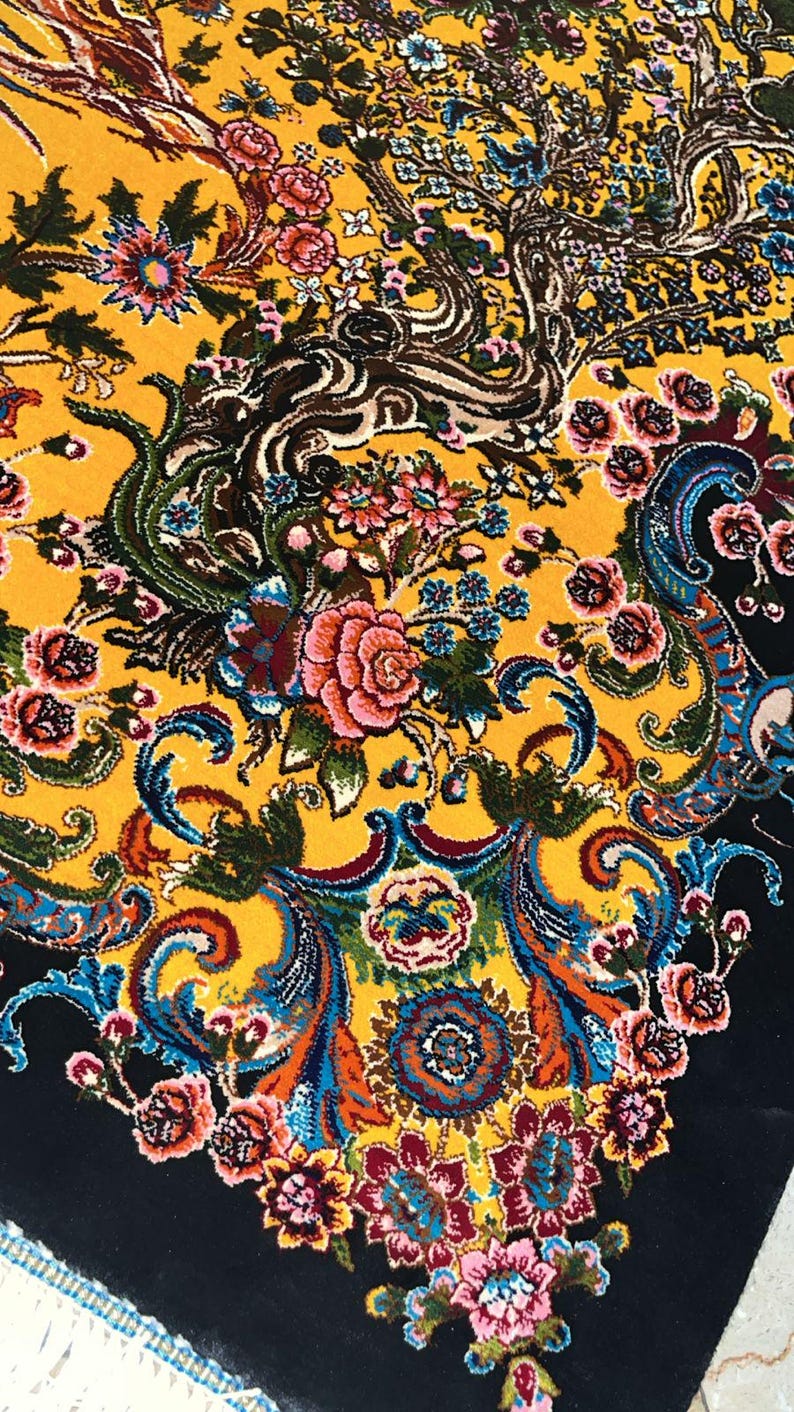 Luxury Persian silk rug in golden yellow with detailed Tabriz-style phoenix and floral design. This 3x5 ft Oriental carpet doubles as a stunning floor piece or elegant wall hanging. Hand-finished with intricate patterns, it adds timeless charm to any space. Ideal for home decor lovers, collectors, or anyone seeking a unique handmade accent rooted in Persian art and tradition.