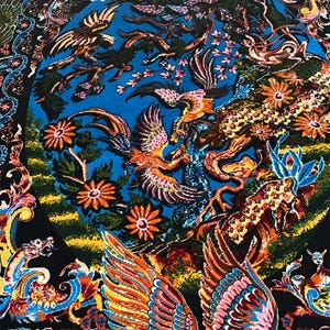 Persian silk rug with vibrant yellow Tabriz-style design featuring a mythical phoenix, intricate floral patterns, and traditional Oriental motifs. This 3x5 ft luxury carpet is ideal as wall art or floor decor. Made with fine silk for a soft texture and rich detail, perfect for adding warmth and elegance to living rooms, bedrooms, or gallery spaces. A beautiful blend of heritage and craftsmanship for art lovers and collectors.
