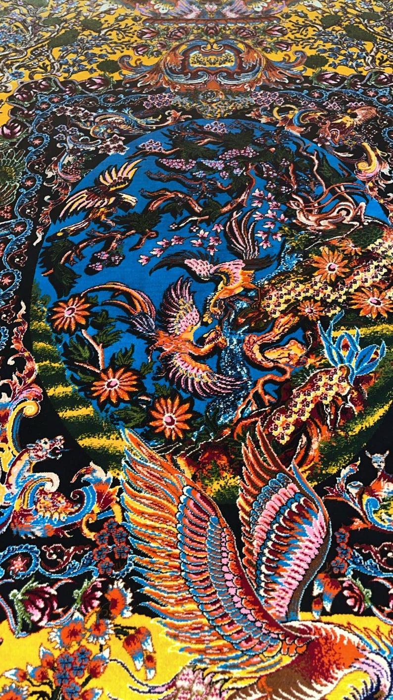 Persian silk rug with vibrant yellow Tabriz-style design featuring a mythical phoenix, intricate floral patterns, and traditional Oriental motifs. This 3x5 ft luxury carpet is ideal as wall art or floor decor. Made with fine silk for a soft texture and rich detail, perfect for adding warmth and elegance to living rooms, bedrooms, or gallery spaces. A beautiful blend of heritage and craftsmanship for art lovers and collectors.