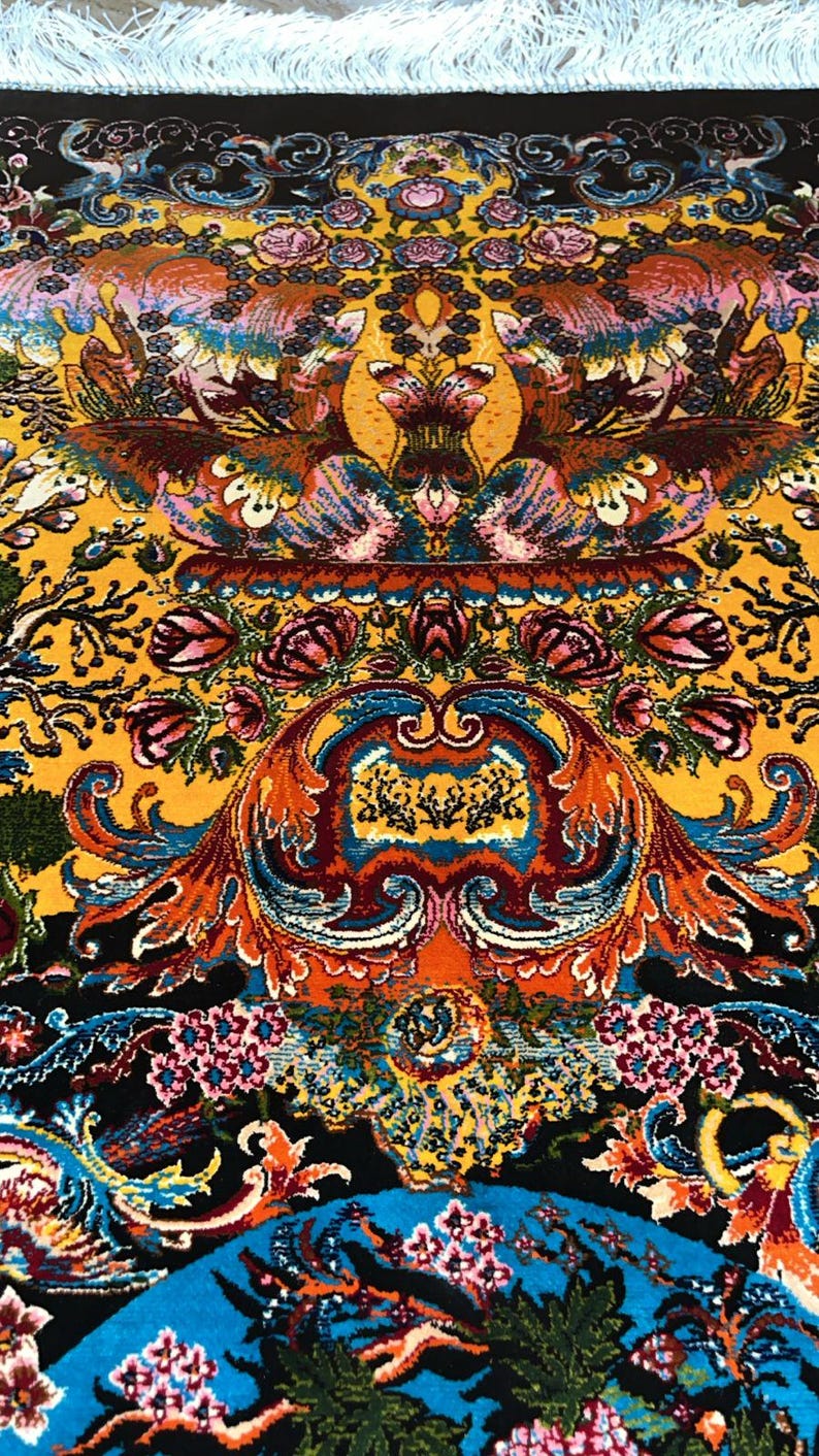 Luxury Persian silk rug in golden yellow with detailed Tabriz-style phoenix and floral design. This 3x5 ft Oriental carpet doubles as a stunning floor piece or elegant wall hanging. Hand-finished with intricate patterns, it adds timeless charm to any space. Ideal for home decor lovers, collectors, or anyone seeking a unique handmade accent rooted in Persian art and tradition.