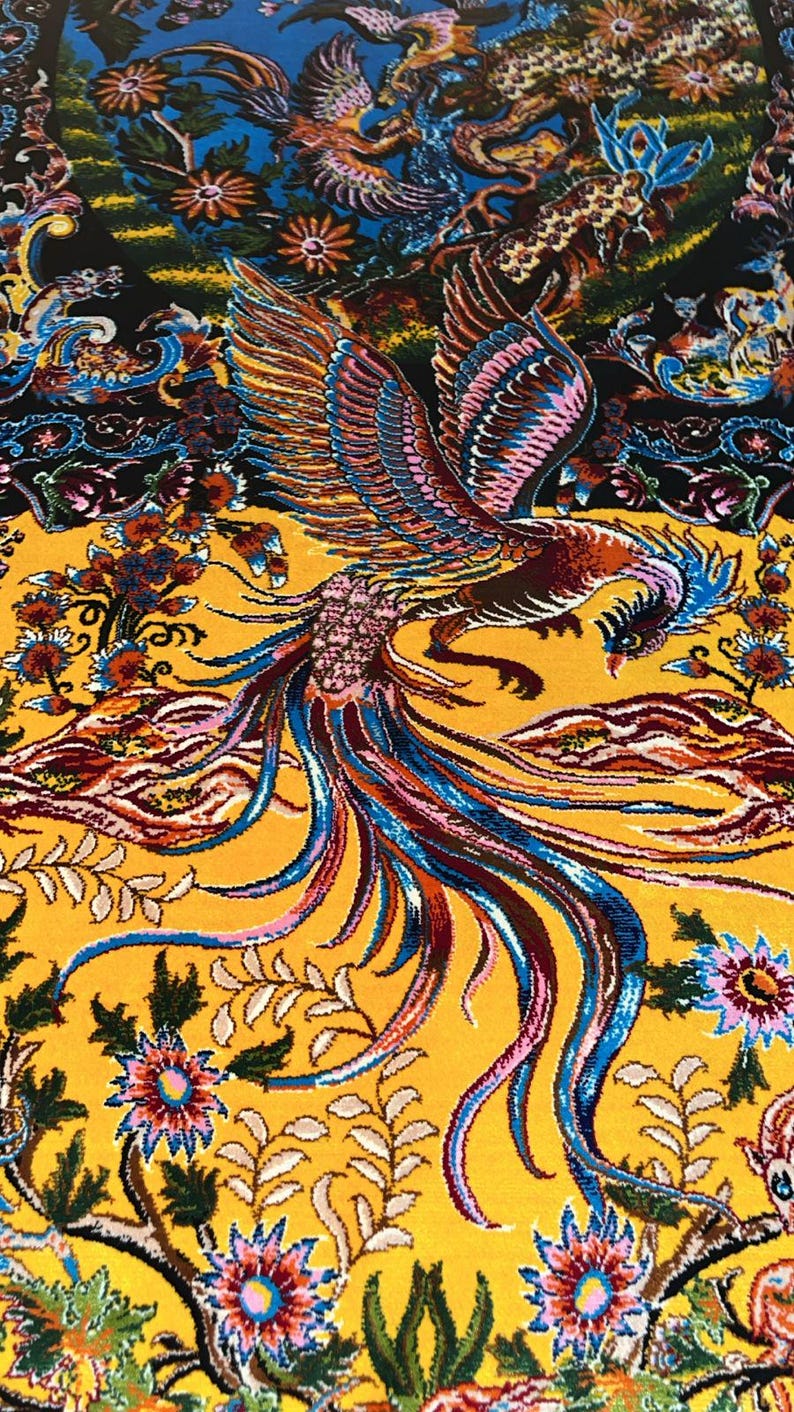 Stunning Persian silk rug in warm yellow tones, featuring a traditional Tabriz phoenix and floral motif. This 3x5 ft piece is ideal as a decorative carpet or wall art. Rich in detail and symbolism, it brings a luxurious, artistic touch to any interior space. Perfect for collectors, design lovers, or anyone wanting a bold, handcrafted statement piece rooted in Persian heritage.