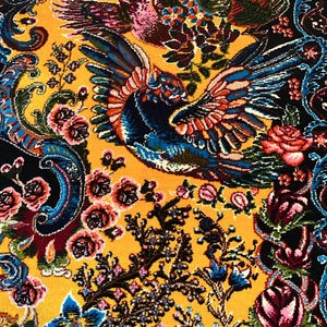 Luxury Persian silk rug in golden yellow with detailed Tabriz-style phoenix and floral design. This 3x5 ft Oriental carpet doubles as a stunning floor piece or elegant wall hanging. Hand-finished with intricate patterns, it adds timeless charm to any space. Ideal for home decor lovers, collectors, or anyone seeking a unique handmade accent rooted in Persian art and tradition.