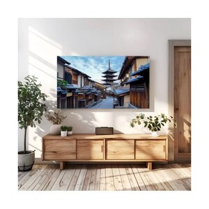 May include: A photograph of a traditional Japanese street with a pagoda in the distance. The street is lined with wooden buildings and the sky is a light blue with clouds.